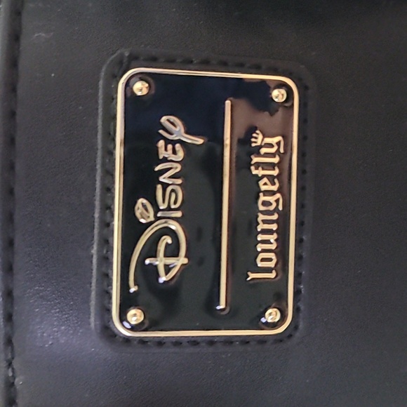 This is a Loungefly Disney Princesses vs. Villains Triple Pocket Mini Backpack.  - Picture 2 of 3